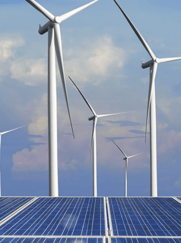 Photo of solar panels and wind farm